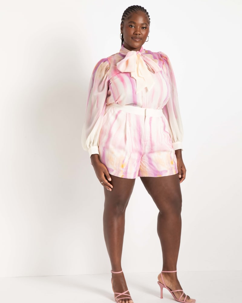 Front of a model wearing a size 18 Printed Linen Shorts in Color Drip by ELOQUII. | dia_product_style_image_id:275276
